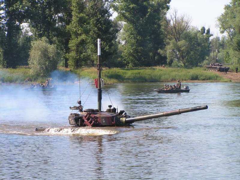A snorkelling T-72 coming out of the water